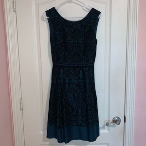 Teal a-line dress with black details